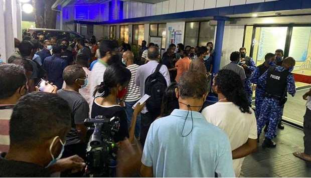 People gather as Maldives President Ibrahim Mohamed Solih arrives at Adk Hospital to visit speaker of parliament and former Maldivian President Mohamed Nasheed who is treated following a car blast attack