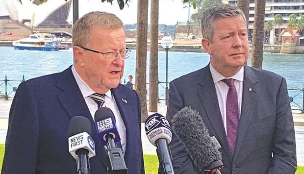 International Olympic Committee Vice President John Coates and Australian Olympic Committee Chief Executive Matt Carroll hold a news conference at Sydney Harbour yesterday.