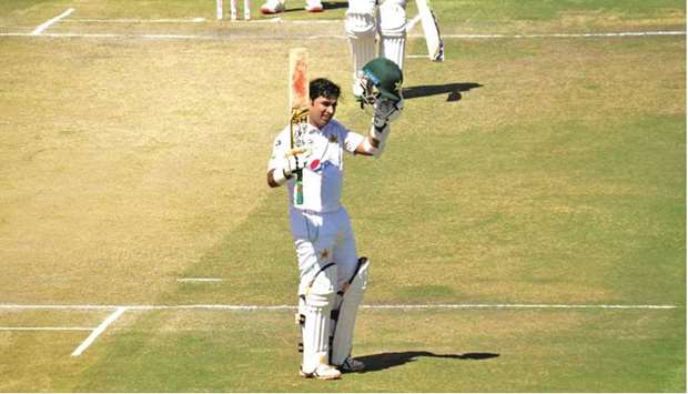 Pakistan opener Abid Ali celebrates after reaching his double century during the first Test against Zimbabwe at Harare Sports Club yesterday. (PCB)