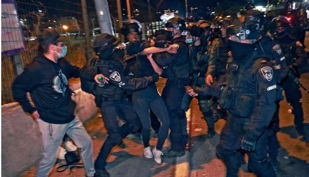 Israeli policemen clash with  protesting Palestinians. AFP
