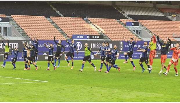 Inter Milanu2019s players celebrate their win over Sampdoria in Milan yesterday. (AFP)