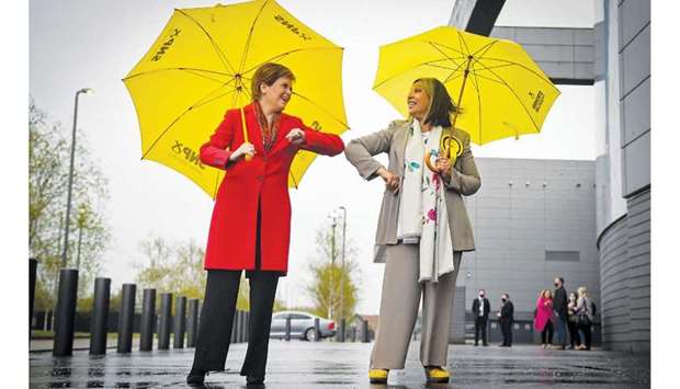 Scotlandu2019s First Minister and leader of the Scottish National Party (SNP) Nicola Sturgeon (left) congratulates SNP candidate Kaukab Stewart after she was elected MSP for Glasgow Kelvin in the Scottish Parliamentary Election, in Glasgow yesterday. (AFP)