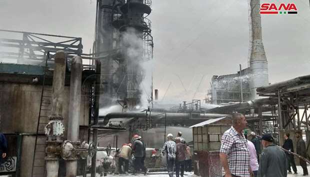 State television showed live footage of fire engulfing parts of the refinery with black smoke plumes in the distance as firefighters tackled the flames.