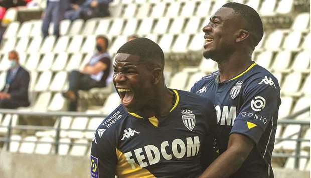 Monacou2019s Eliot Matazo (left) celebrates his goal during the Ligue 1 match against Reims in Reims, France, yesterday. (AFP)