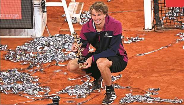 Germanyu2019s Alexander Zverev poses with the winneru2019s trophy after beating Italyu2019s Matteo Berrettini (not pictured) in the Madrid Open final yesterday. (AFP)