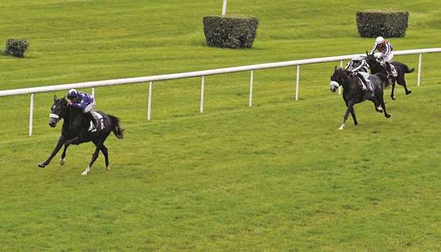 Guillaume Guedju2013Gay (left) guides Moharram to Prix Djelfor victory in Bordeaux, France, on Sunday. (Robert Polin)