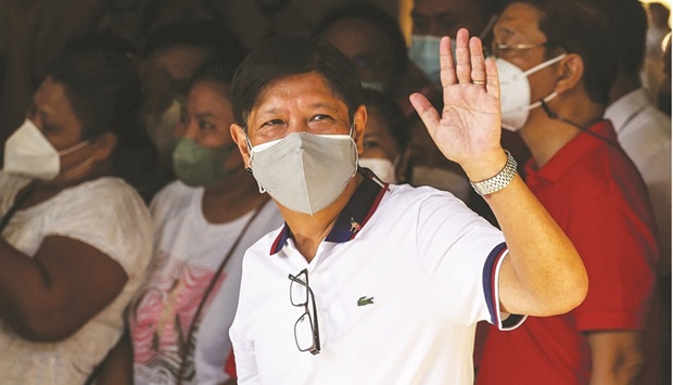 Philippine presidential candidate Ferdinand Marcos Jr waves after casting his vote at Mariano Marcos Memorial Elementary School in Batac, Ilocos Norte, yesterday. (AFP)