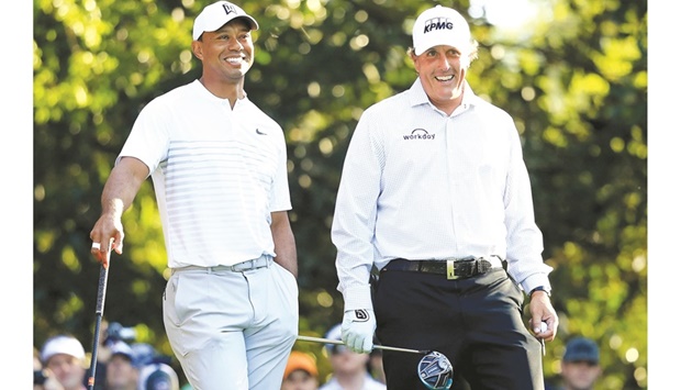 Tiger Woods (left) with Phil Mickelson.