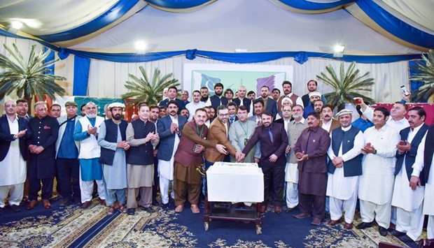 . Pakistan embassyu2019s Community Welfare Attache Waheedullah Khan and Political Counsellor Ali Ahsan accompanied by community members cut a cake to mark the event. 