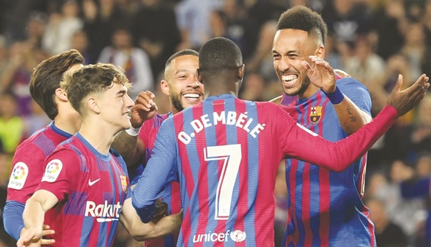 Barcelonau2019s Pierre-Emerick Aubameyang (right) celebrates with teammates after scoring against Celta Vigo in Barcelona. (AFP)