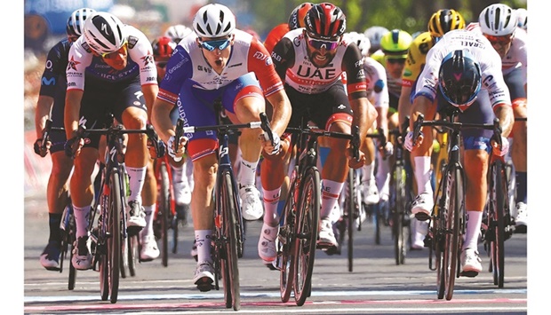 Team Groupama-FDJu2019s French rider Arnaud Demare (second left) crosses the finish line to win the 5th stage of the Giro du2019Italia 2022 cycling race, 174 kilometres between Catania and Messina, Sicily, yesterday. (AFP)