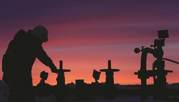A worker checks the valve of an oil pipe at an oil field owned by Russian state-owned oil producer Bashneft near the village of Nikolo-Berezovka, northwest of Ufa, Bashkortostan, Russia (file). With shipments continuing to flow from Moscow u2013 and proving more resilient than many anticipated u2013 delegates say the 23-nation Opec+ group will likely ratify another modest production increase when it gathers this week.
