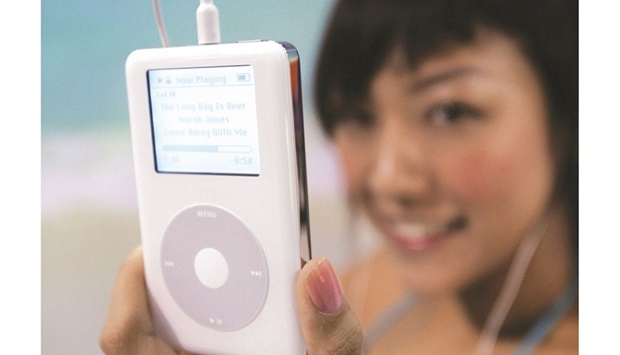 In this file photo taken on July 21, 2004, a model shows the latest model of Apple iPod during a presser in Hong Kong. (AFP)