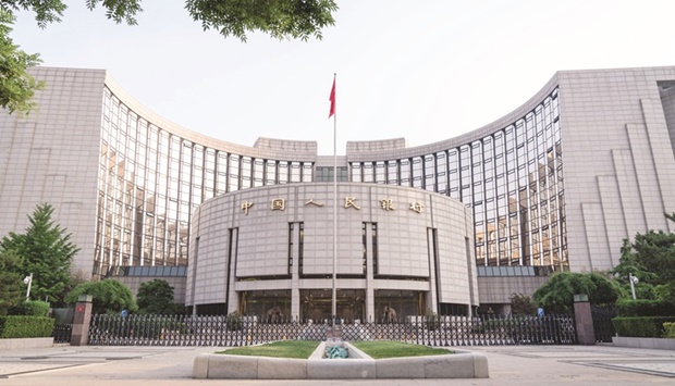 The Peopleu2019s Bank of China headquarters building in Beijing. Chinau2019s loan growth weakened sharply in April to the worst level in almost five years, with mortgage loans contracting again as Covid lockdowns and the property market slump disrupted economic activity and sapped borrowing demand.