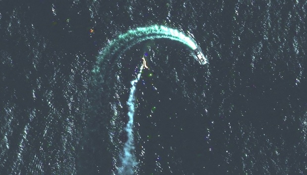 A satellite image shows a Serna-class landing craft and possible missile contrail near Snake Island, Ukraine on May 12.  Satellite image 2022 Maxar Technologies/Handout via REUTERS