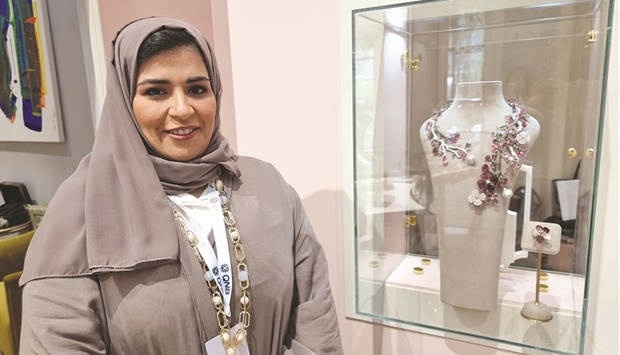 Nada Khamis al-Sulaiti showcasing her award-winning piece. She also held a workshop at DJWE titled u2018The Story of Hairaat.u2019