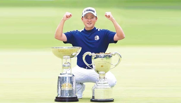 Shugo Imahira of Japan poses after winning the Asia Pacific Open Golf Championship Diamond Cup at the Oarai Golf Club at Ibaraki Prefecture in Japan, yesterday. (AFP)