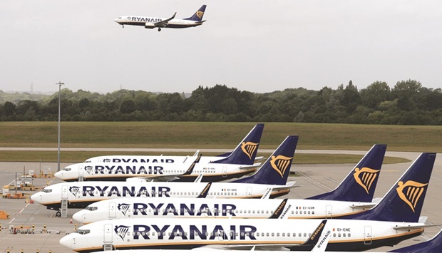 Ryanair aircraft are pictured at Stansted airport, northeast of London. Ryanair announced yesterday a large reduction in annual net losses as the aviation sector recovered from pandemic lockdowns.