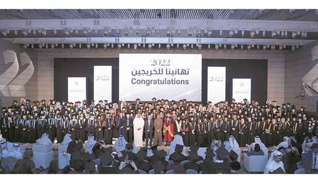 Graduates with the dignitaries.
