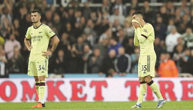 Arsenalu2019s Granit Xhaka (left) and Gabriel Martinelli are dejected after their loss to Newcastle United in the Premier League at the St Jamesu2019 Park in Newcastle, Britain, on Monday night. (Reuters)