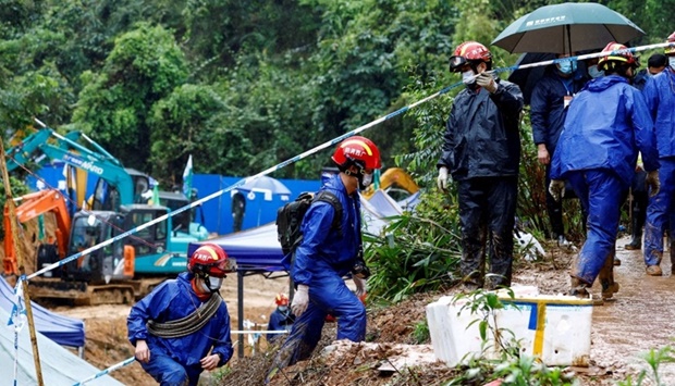 Rescue workers work at the site where a China Eastern Airlines Boeing 737-800 plane flying from Kunming to Guangzhou crashed, in Wuzhou, Guangxi Zhuang Autonomous Region, China March 24. REUTERS/Carlos Garcia Rawlins/File Photo