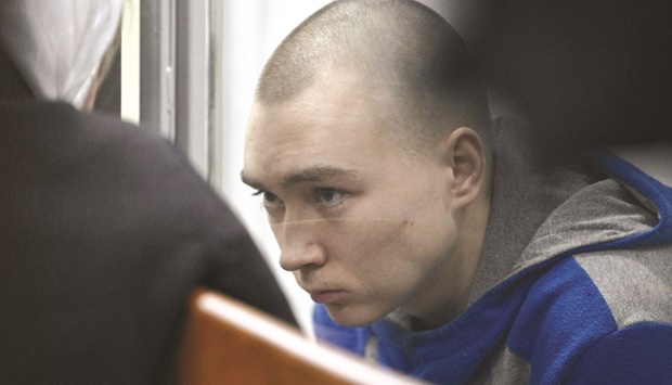 Russian soldier Vadim Shishimarin in the defendantu2019s box at the opening of his trial in the Solomyansky district court in Kyiv yesterday. (AFP)