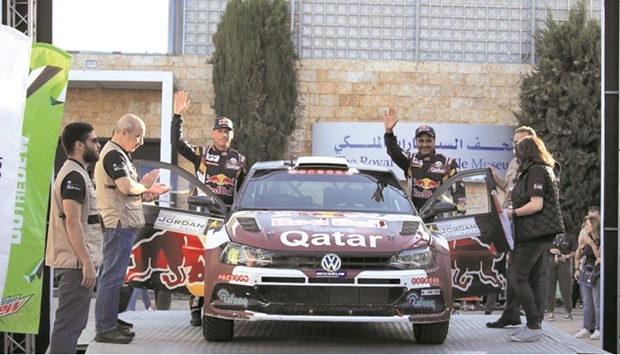 Qataru2019s Nasser Saleh al-Attiyah and his co-driver Mathieu Baumel during the ceremonial start of the Jordan Rally at the Royal Automobile Museum in Amman yesterday.