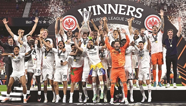 Eintracht Frankfurtu2019s captain Sebastian Rode lifts the trophy as he celebrates with his teammates after winning the Europa League in Seville on Wednesday night. (AFP)