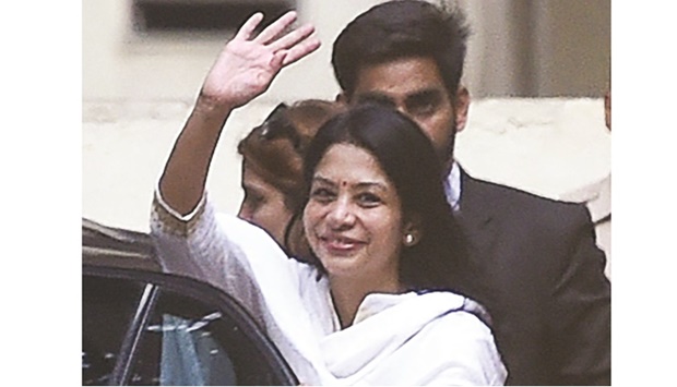 Former media executive Indrani Mukerjea waves as she leaves the Byculla district jail after she was freed on bail in Mumbai yesterday.