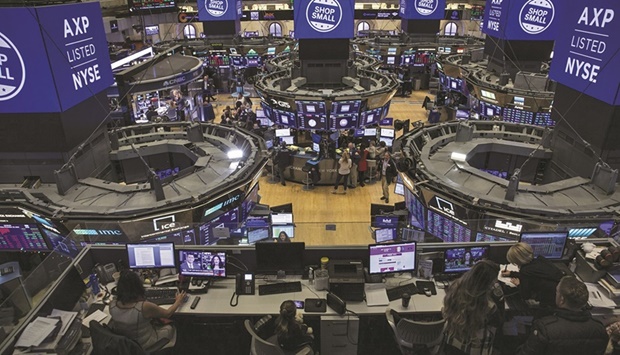 Traders work on the floor of the New York Stock Exchange (file). The Federal Reserveu2019s determination to raise interest rates until it squashes the highest inflation in decades is darkening the outlook across Wall Street, as US stocks stand on the cusp of a bear market and warnings of a recession grow louder.
