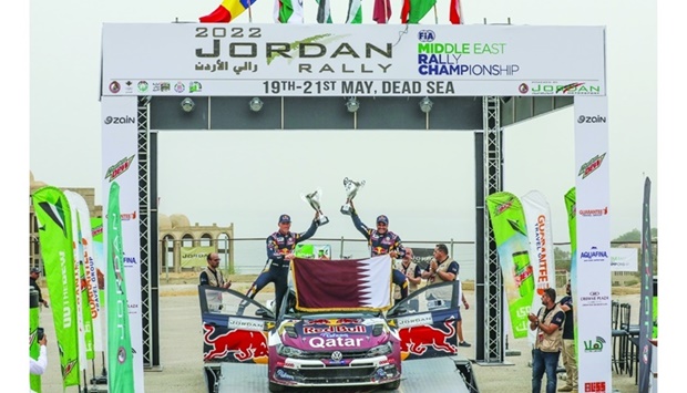 Qataru2019s Nasser Saleh al-Attiyah celebrates with his French co-driver Mathieu Baumel after winning the Jordan Rally Saturday. Al-Attiyah, who won for the 15th time in Jordan, is now very close to a record-breaking 18th FIA Middle East Rally Championship (MERC) title. Saturdayu2019s win also marked al-Attiyahu2019s 81st career MERC success and his third of the season.