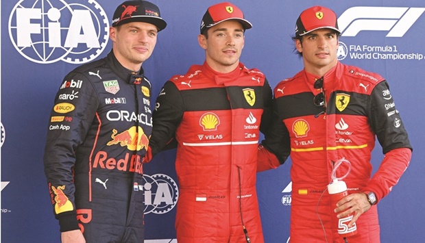 Ferrariu2019s Monegasque driver Charles Leclerc (centre) celebrates after qualifying for Spanish Formula One Grand Prix in pole position with second-placed Red Bullu2019s Max Verstappen (left) and third-placed Ferrariu2019s Spanish driver Carlos Sainz Jr in Barcelona yesterday. (AFP)