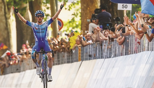 Team BikeExchange Jayco Mitcheltonu2019s rider Simon Yates celebrates as he crosses the finish line to win the 14th stage of the Giro du2019Italia in Turin yesterday. (AFP)