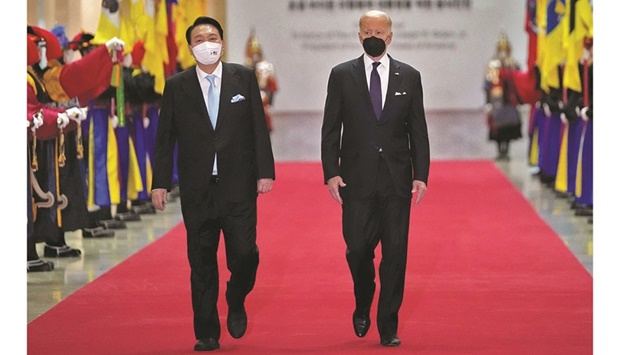 South Korean President Yoon Suk-yeol and US President Joe Biden arrive for a state dinner at the National Museum of Korea in Seoul.