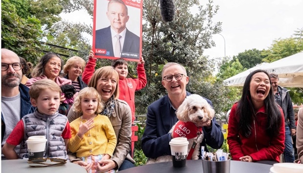Leader of the Australian Labor Party Anthony Albanese (C) meets with Labor candidate for Reid, Sally Sitou (R) and supporters after winning the general election at Marrickville Library and Pavilion in Sydney. AFP