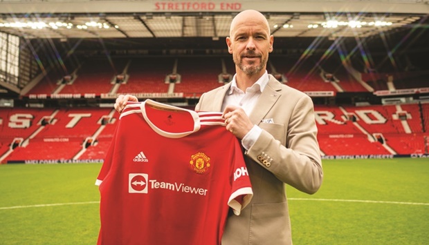 Manchester Unitedu2019s new manager Erik ten Hag poses with the clubu2019s jersey at his unveiling at Old Trafford yesterday.