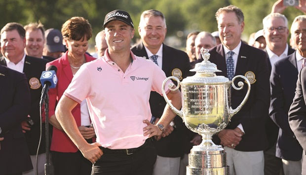 Justin Thomas of the US poses with the Wanamaker Trophy after putting in to win on the 18th green, the third play-off hole during the final round of the 2022 PGA Championship at Southern Hills Country Club in Tulsa, Oklahoma. (AFP)