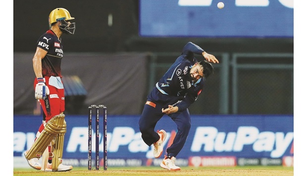 Virat Kohli (left) of Royal Challengers Bangalore and Rashid Khan of Gujarat Titans in action during one of the IPL matches prior to the play-offs.