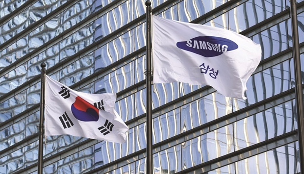 The Samsung flag and South Korean national flag fluttering outside the companyu2019s Seocho building in Seoul. The tech giant is South Koreau2019s largest chaebol u2014 the family-run conglomerates that dominate the economy u2014 and its overall turnover is equivalent to a fifth of the national gross domestic product.