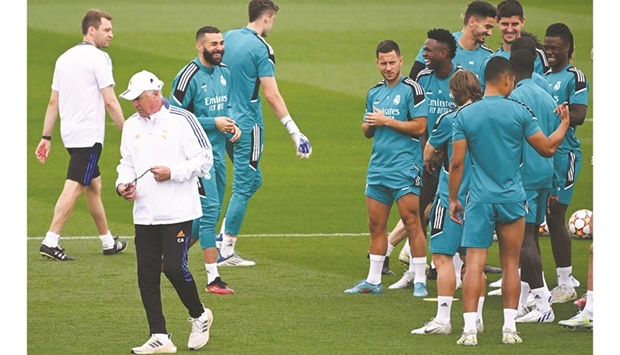 Real Madridu2019s coach Carlo Ancelotti (left) and his players at a training session in Madrid yesterday. (AFP)
