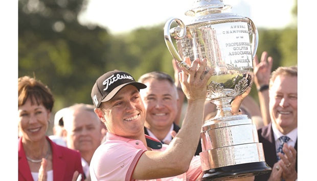 Justin Thomas of the US poses with the Wanamaker Trophy after putting in to win on the 18th green during the final round of the 2022 PGA Championship at Southern Hills Country Club in Tulsa, Oklahoma. (AFP)