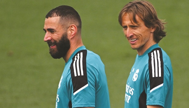 Real Madridu2019s French forward Karim Benzema (left) and Croatian midfielder Luka Modric during a training session at the Ciudad Real Madrid in the Madridu2019s suburb of Valdebebas. (AFP)