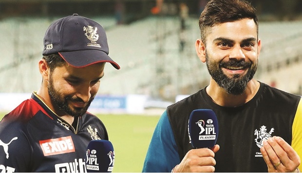RCB batters Virat Kohli is seen with Rajat Patidar during a post-match TV interview on Wednesday.