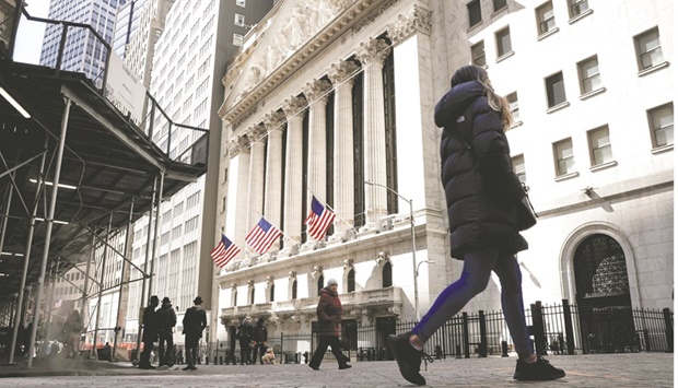 People are seen on Wall Street outside the New York Stock Exchange. Corporate insiders, whose purchases correctly signalled the bear-market bottom in 2020, are bottom fishing during the S&P 500u2019s longest stretch of weekly losses in two decades.