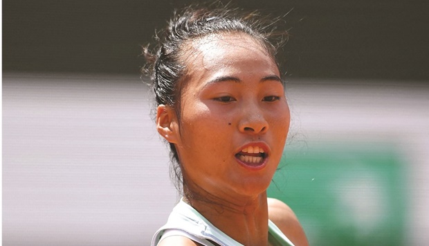 Chinau2019s Zheng Qinwen returns the ball to Franceu2019s Alize Cornet during their third round match on day seven of the French Open at the Court Philippe-Chatrier in Paris yesterday. (AFP)