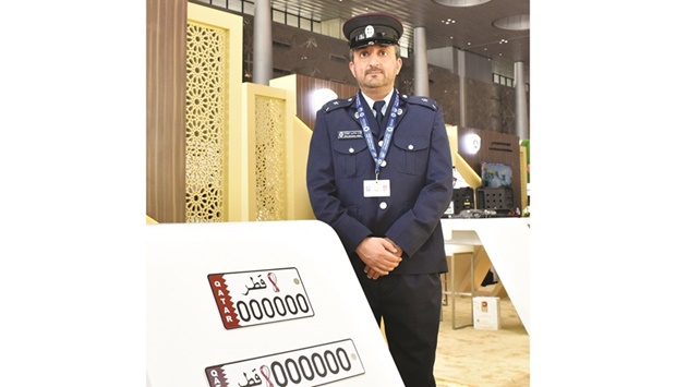 Lt Faisal Abdul Azeez al-Haidouse with samples of number plates with FIFA World Cup Qatar 2022 logo. PICTURE: Thajudheen.