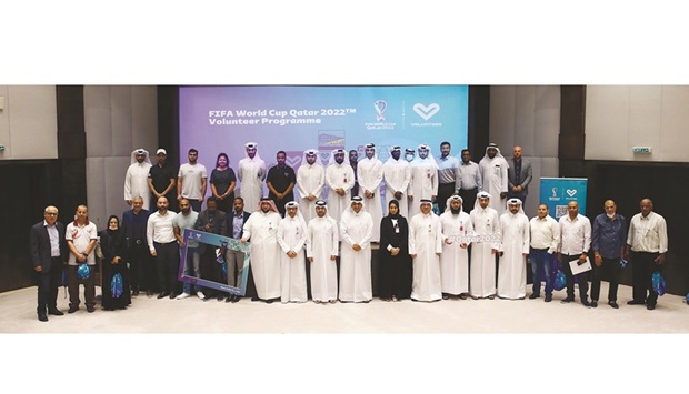 Officials and particiapants posing for a group photograph at the conclusion of the QOCu2019s Volunteers Promitional Workshop for FUFA World Cup Qatar 2022.