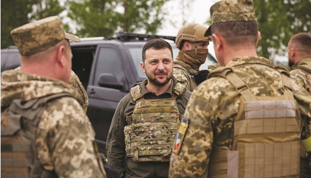Ukrainian President Volodymyr Zelensky visits a place of a fight with Russian troops in Kharkiv region yesterday. (Reuters)