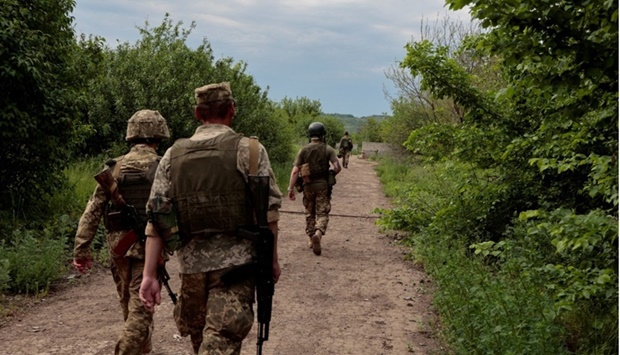 Ukrainian servicemen patrol an area near a frontline, as Russia's attack on Ukraine continues, in Donetsk Region, Ukraine on May 29. REUTERS