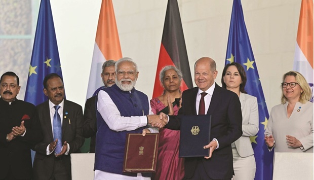 German Chancellor Olaf Scholz and Indian Prime Minister Narendra Modi shake hands after signing an agreement during Indo-German governmental consultations at the Chancellery in Berlin yesterday.